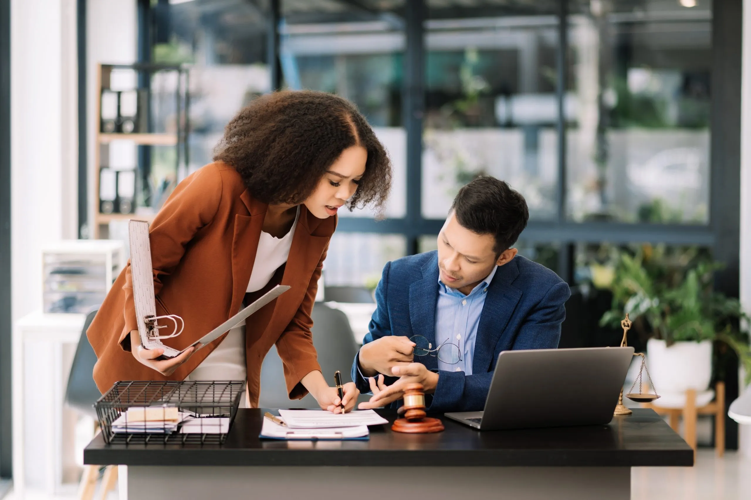 Professionals reviewing workplace investigation documentation